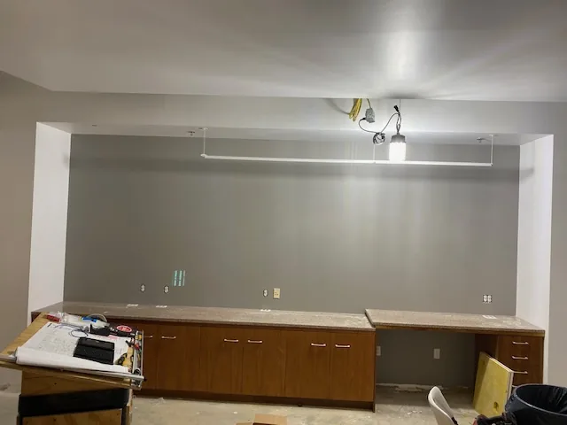 Commercial kitchen area painted gray during construction