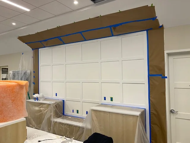 Commercial paneled wall taped and prepared for painting
