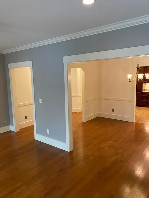 Gray residential dining room with chandelier