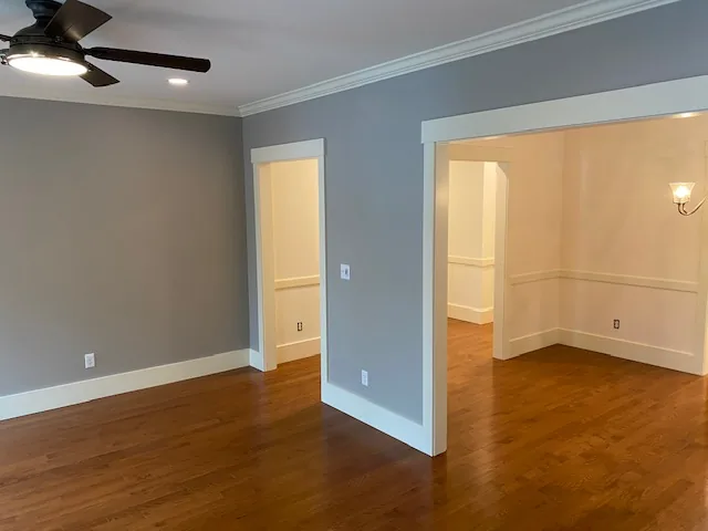 Finished gray residential room with hardwood floor